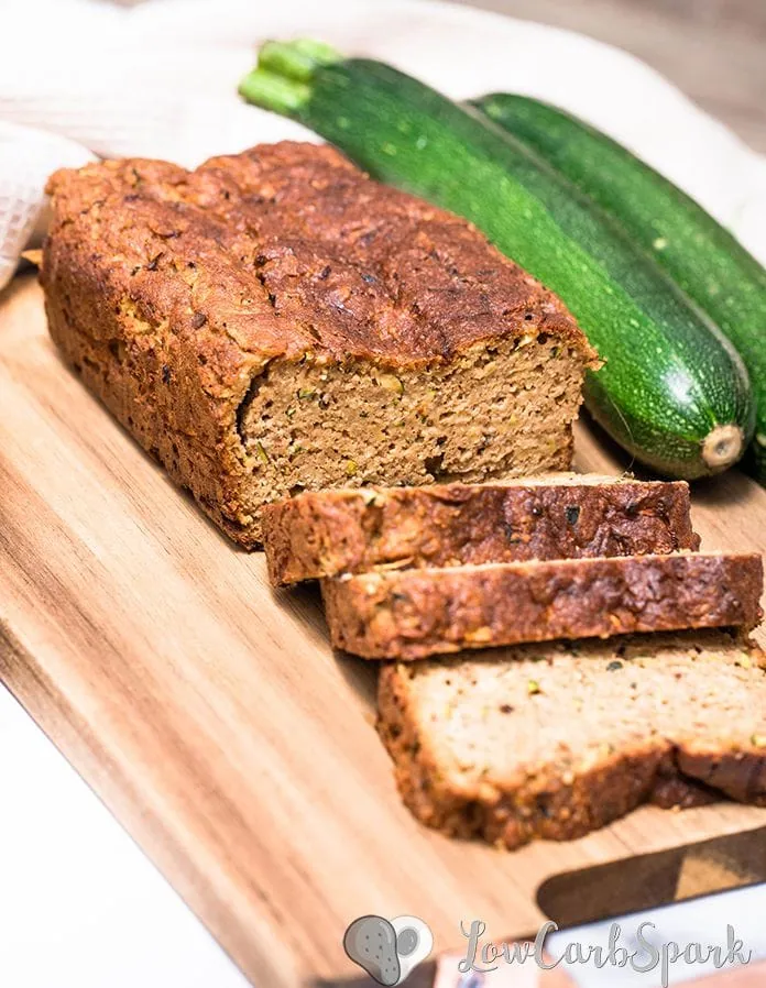 This keto zucchini bread recipe is super moist, perfectly spiced, and low in carbs bread with grated zucchini, cinnamon, nutmeg, and optional walnuts or pecans. You can turn the batter into zucchini muffins too!