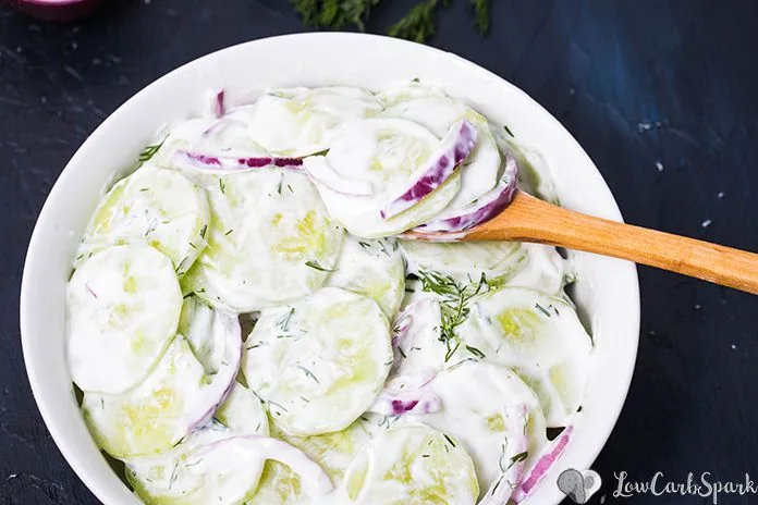 This classic cucumber salad is a delicious summer treat made with crunchy fresh cucumbers, red onion, fresh dill all tossed in a sweet and tangy, creamy sour cream dressing. It's incredible how quick it is to make, and it's the perfect side dish for every barbecue or picnic. #cucumbersalad #salad #cucumber #germansalad