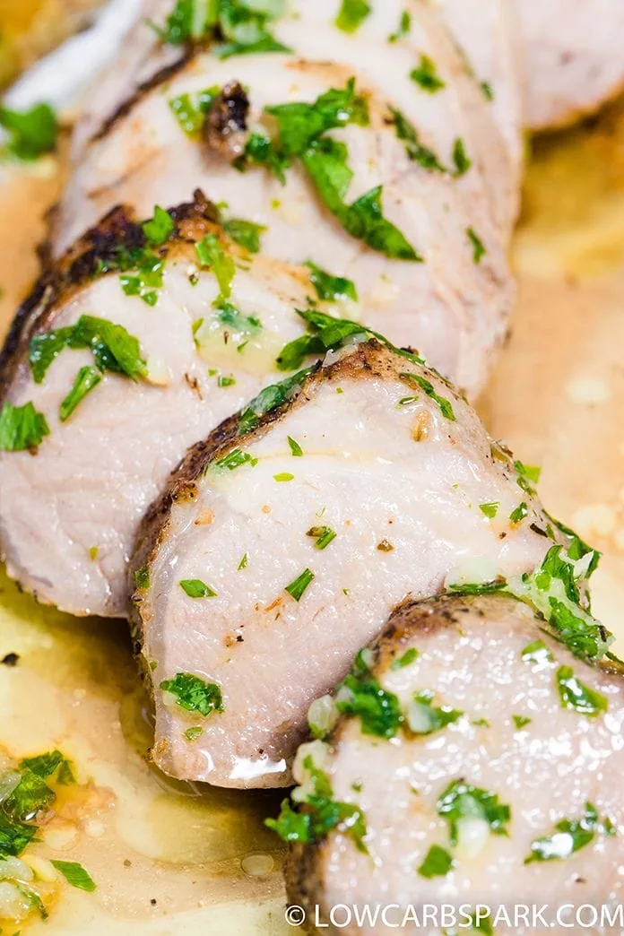 pork tenderloin recipe sliced with parsley and butter
