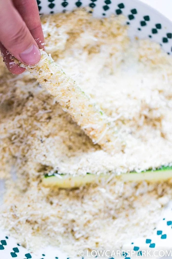 coat zucchini fries with parmesan and almond flour