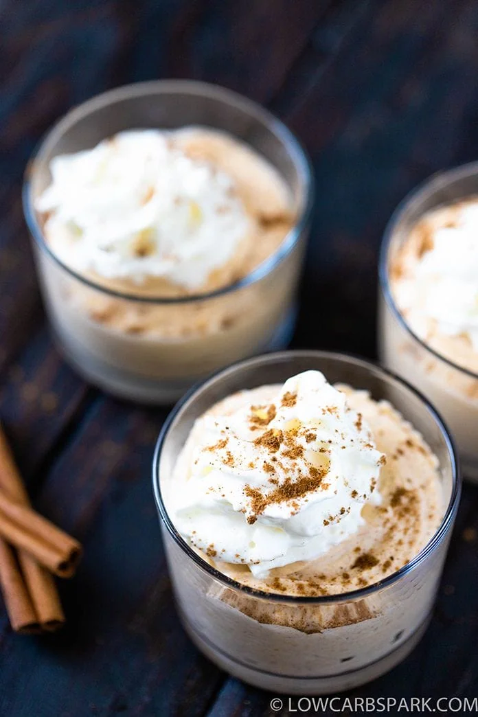easy pumpkin mousse recipe in individual servings jars topped with sugar free whipped cream and pumpkin pie spice no sugar added dessert perfect for fall keto dessert and plaeo dessert