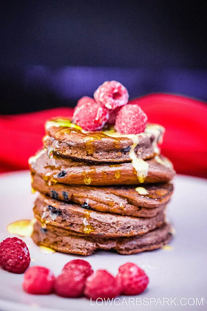 These gluten-free protein pancakes are packed chocolate flavor with no refined sugar or wheat flours. Enjoy a tall stack of fluffy protein pancakes that are low carb and keto-friendly.