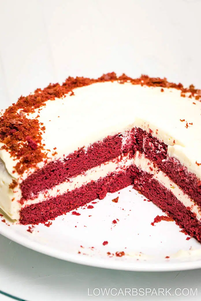 layered keto red velvet cake with sugar free cream cheese frosting sections