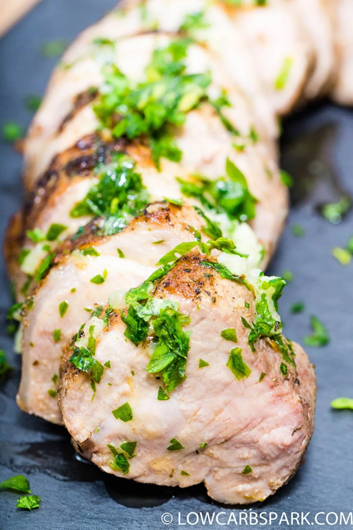 a close up of garlic butter pork tenderloin