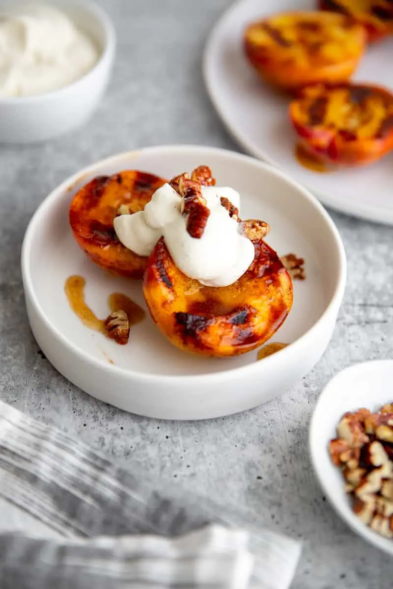 Grilled Peaches with Honey Cardamom Whipped Cream